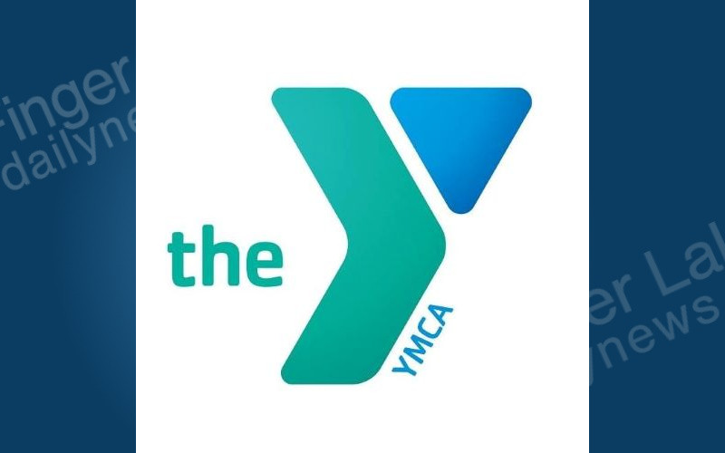 The modern YMCA logo, featuring a teal 'the' and 'Y' shape, a blue triangle, and 'YMCA' text on a white background.