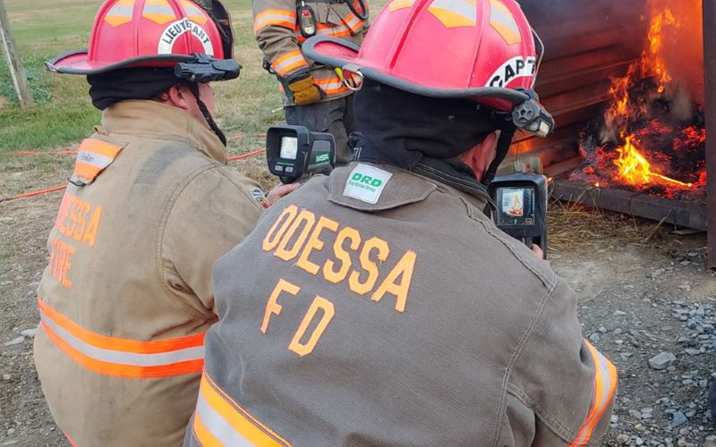 Odessa firefighters use thermal imaging devices during a controlled training fire.