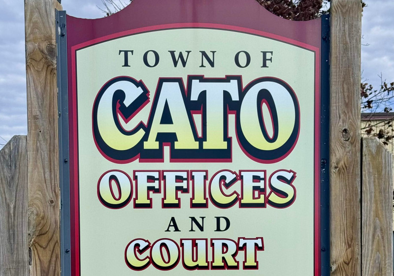 A sign for the Town of Cato Offices and Court, indicating a municipal building.