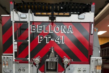 Rear of Bellona Fire Department truck PT-41, red and black stripes, with rescue equipment and ladder.