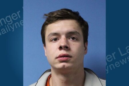 Mugshot of Cayne Hartman, a young man with short dark hair, arrested in Lyons, NY.
