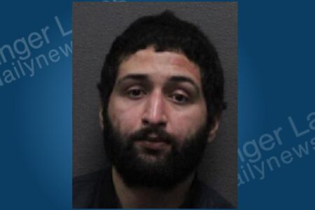 Mugshot of Celestino Nieves, a man with dark hair and a beard, looking directly at the camera.