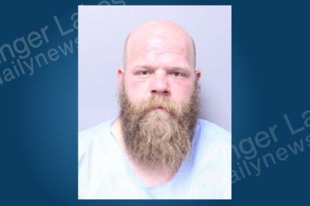 Mugshot of Darrin Badman, a bald man with a long beard, facing a felony contempt charge.