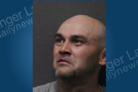 Mugshot of David Christian, a bald man with a beard, looking up and to the right.