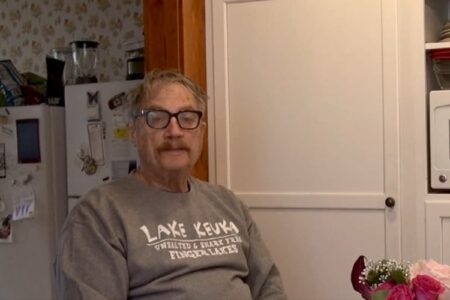 Jim Bobreski, a Penn Yan man challenging Senator Tom O'Mara, sits indoors wearing a Lake Keuka sweatshirt.