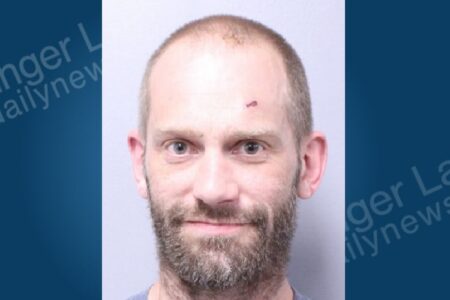 Mugshot of Kurtis Pearsall, a man with a beard and a cut on his forehead, arrested in Aurelius.