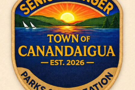 A 'Senior Ranger' patch for Canandaigua Parks & Recreation, depicting a lake sunset with sailboats and hills.