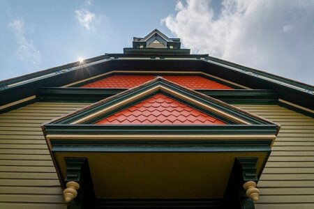The Thompson Memorial A.M.E. Zion Church, part of the Harriet Tubman National Historical Park, with red shingles and green trim.