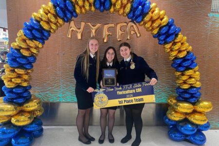 Three Penn Yan FFA members proudly display their 1st Place Team award for Floriculture CDE at the NYFFA State Finals.
