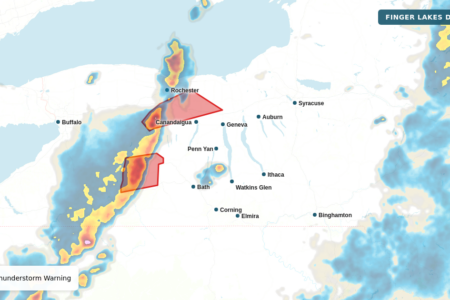 Weather map showing severe thunderstorm warnings and precipitation over upstate New York, including Livingston, Ontario, and Wayne counties.