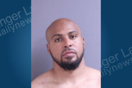 Mugshot of Antonio Kirkland, a bald man with a beard, looking directly at the camera.