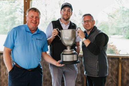 Three men from Bowers Accountants proudly hold the Chamber Cup trophy after winning a golf tournament.
