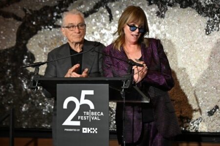Robert De Niro and Jane Rosenthal speak at a podium with the '25 Tribeca Festival' logo.