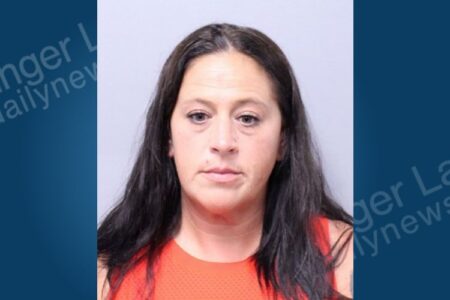 Mugshot of Marybeth Rizzieri, a woman with long dark hair, arrested in Sennett for domestic dispute.