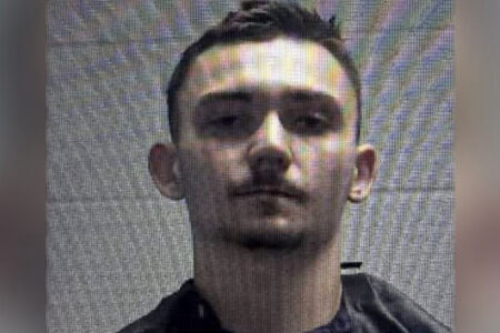 Mugshot of Karson Hyder, a young man with short dark hair and a light mustache, looking directly at the camera.