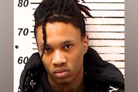 Mugshot of a young man with dreadlocks, identified as a suspect in the Ohio festival shooting.