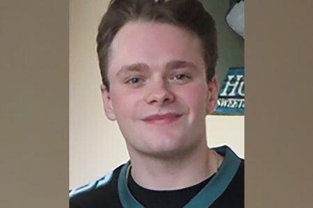 Headshot of Billy Schmidt, a young white man with short brown hair, smiling slightly.