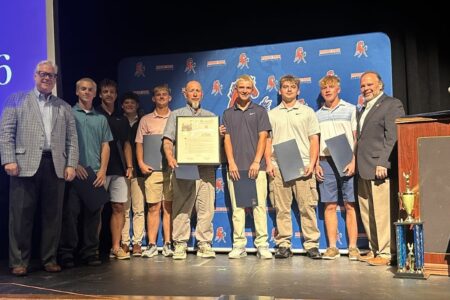 Senator O'Mara and Assemblyman Palmesano honor Penn Yan Lacrosse State Champions with certificates and trophies.