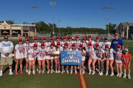 Penn Yan Girls Lacrosse team and coaches celebrate their 4th straight Sectional Title, holding a "2026 V CHAMPIONS" banner.