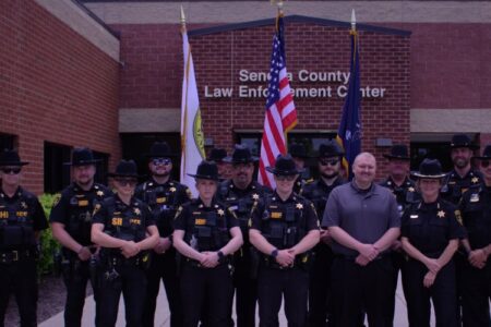 Seneca County Sheriff's Office members pose with retiring Sheriff Thompson outside the Law Enforcement Center.
