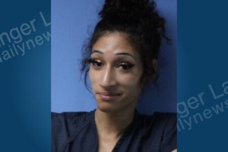 Mugshot of Shy McCarthy, a woman with dark hair, arrested in Lyons, NY for domestic violence.
