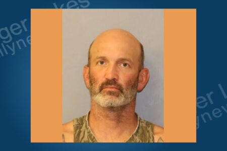 Mugshot of Trevor Dobson, a bald man with a beard, looking directly at the camera.