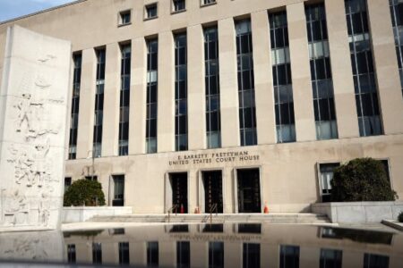 E. Barrett Prettyman U.S. Court House in Washington D.C., with a stone relief and reflection pool.